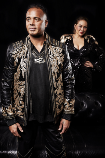 Ray Slijngaard & Michèle Karamat Ali from 2 Unlimited photoshoot in black 2 Unlimited outfits vertical shot